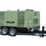 CompressAir | Green sullair portable diesel air compressor mounted on a dual-wheel trailer.